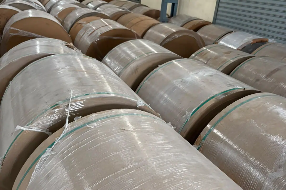Rolls of different paper materials used in corrugated manufacturing